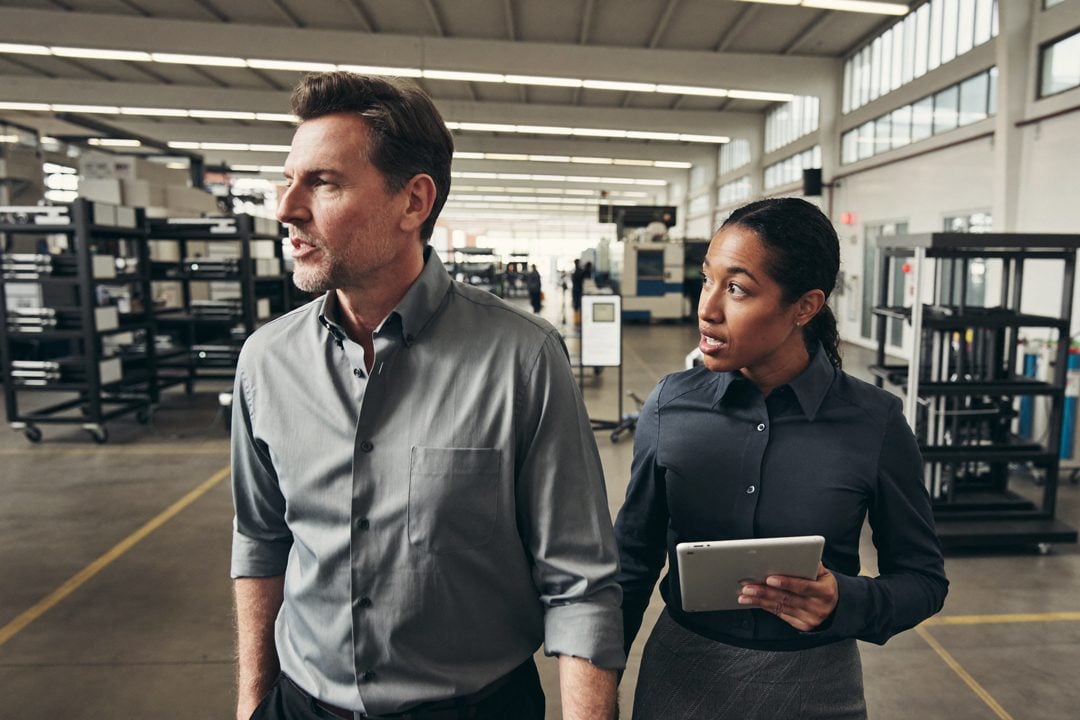 A business owner walking the floor of the real business